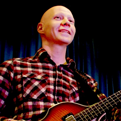 Peter Jorgensen playing the bass guitar